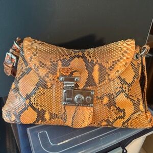 An authentic Orange & Black Snakeskin Handbag  Tanner Krolle London